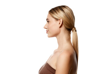 Fototapeta premium Side view portrait of young woman demonstrating isolated on white studio background. Perfect balance of skin care and natural beauty. Concept of beauty, skin and body care, spa, beauty procedures