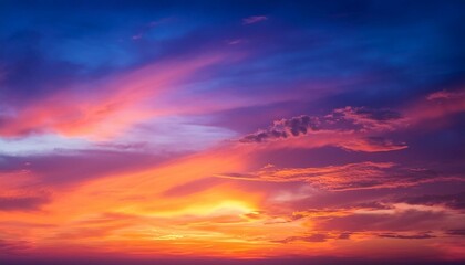 Obraz premium An ethereal summer sunset or sunrise sky, with a rich gradient of blue, purple, orange, red, yellow colors.