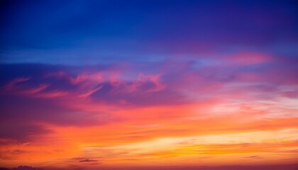 Obraz premium An ethereal summer sunset or sunrise sky, with a rich gradient of blue, purple, orange, red, yellow colors.