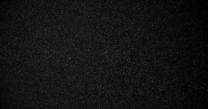 Black sand grunge background. Сlose-up.