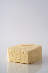 Piece of cheese isolated on a white background.