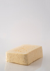 Piece of cheese isolated on a white background.