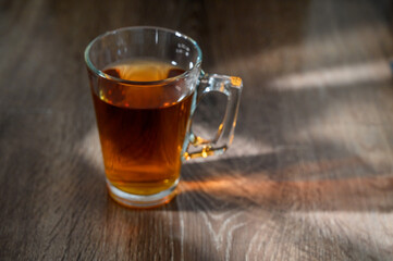 cup of hot tea on wooden table