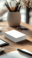 Business Card Mockup on Stacked PapersOffice Supplies and Professional Background