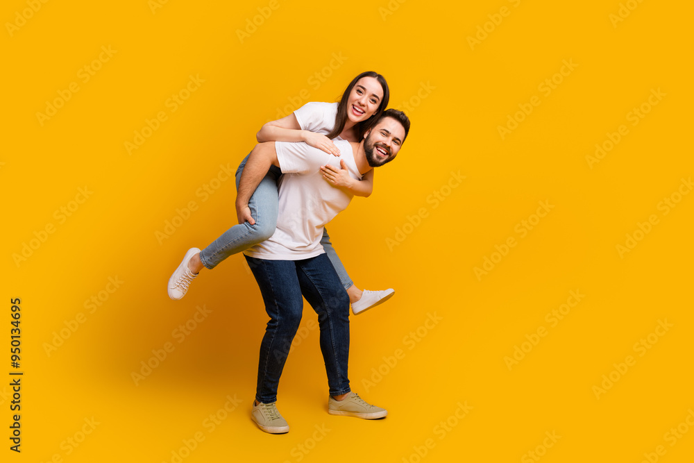 Sticker Full length photo of lovely young guy girl cuddle piggyback dressed stylish white garment isolated on yellow color background