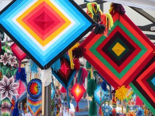 Fototapeta premium traditional wixarika art - ojo de dios and jewelry, Mexico