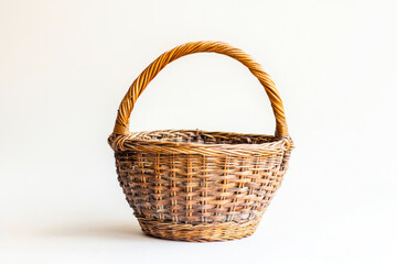 Wicker basket with handle side view on White background.