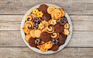 Mix of cookies . Many unhealthy snacks . Top view