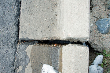 crack in a concrete parking stop