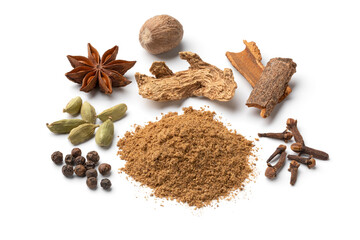 Heap of traditional spicy coffee herbs and dried herbs around close up isolated on white background