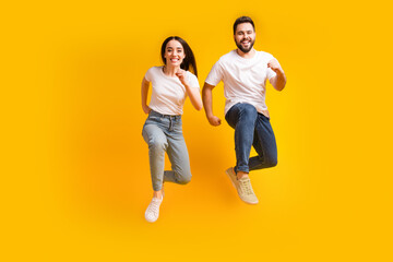 Full body photo of attractive young man woman running hurry black friday dressed stylish white clothes isolated on yellow color background