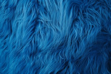 Obraz premium A blue fur texture with a blue background. The fur is long and fluffy. The blue color gives a sense of calmness and relaxation
