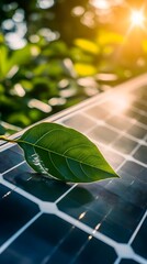 A close-up of solar panels with sunlight shining on them, and an isolated green leaf placed next to the panel