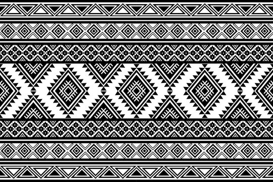 Black and white tribal geometric seamless pattern with ethnic aztec ornaments diamond motifs and decorative boho border design for textile wallpaper fabric and surface backgrounds