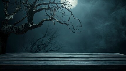 Old wood table and silhouette dead tree at night for Halloween background.