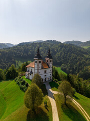 Fototapeta premium Aerial shot of saint Volbenk church in Slovenia, church with two towers drone shot.