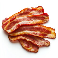 Savory strips of crispy bacon stacked on a white surface, perfect for breakfast or culinary inspiration.