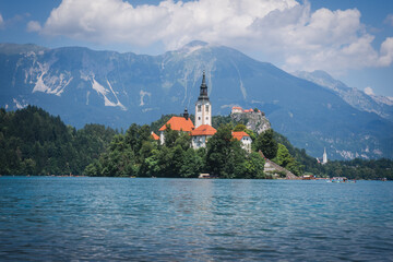 Lake Bled in Slovenia, beautiful church on the island framed and surrounded by the Alps, in the...