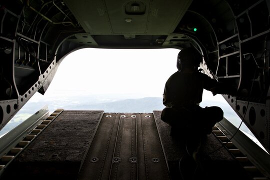 A man is sitting on the side of a plane