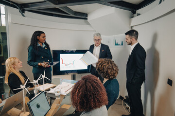 Diverse team of businesspeople having a meeting about renewable energies