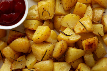 Homemade Oven Roasted Potatoes on a Plate, top view. Flat lay, overhead, from above.