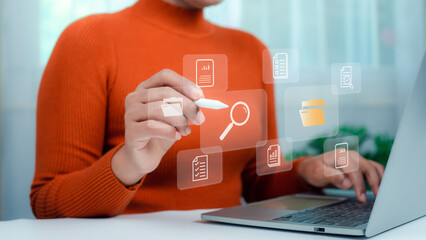 Businesswoman using laptop, Document management system concept, Folders and document icon software, Online document database file management Powerful company information Search and archive.