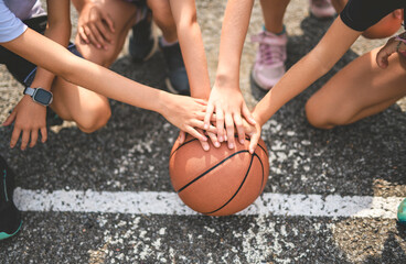 hand over hand view with basketball on a basket court