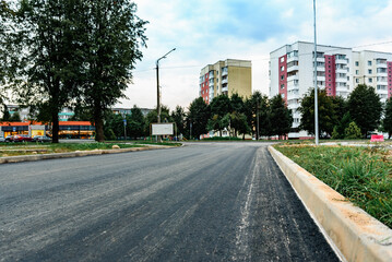 Asphalt road after laying asphalt. New asphalt road renovation. Road construction.