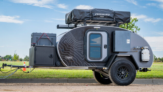 Loveland, CO, USA - August 25, 2024: Topo Escapod off road teardrop trailer with Freespirit FSR roof top tent.