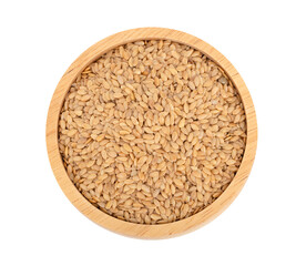 Flax seeds gold in wooden bowl.top view