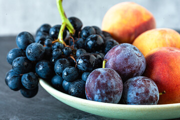 Autumn fruits on a plate, close up