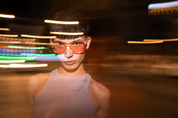 Nighttime urban portrait of a stylish young gay man