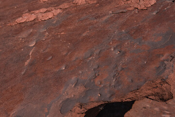 Close up of a red sandstone in former quarry