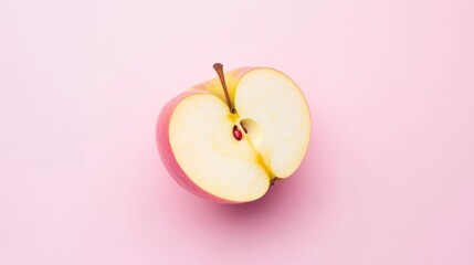 Half an Apple on Pink Background