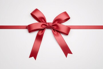 Red satin ribbon tied into a bow on white background.