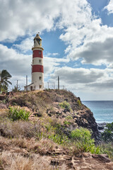 Lighthouse on a cliff during sunset in Albion, Mauritius