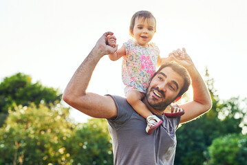 Girl, baby and dad in park with shoulders, holding hands or playful bonding on vacation in summer. Father, child and happy for love, care and portrait on walk in garden, nature or outdoor in sunshine