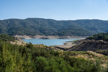 panoramic view of ancient buildings against the backdrop of nature and mountain gardens on a sunny day on the island of Crete in Greece