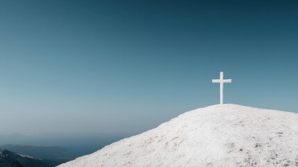 This image captures a snowy hilltop with a solitary white cross set against an expansive blue sky, evoking themes of peace, solitude, and contemplation.
