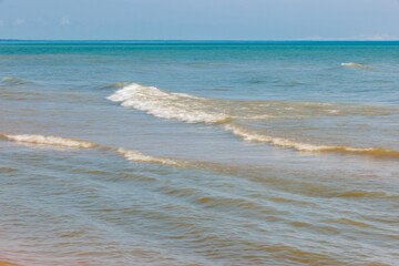 Under a blue sky, Lake Michigan in mid-August is tranquil and calm, offsore at Harrington Beach State Park, Belgium, Wisconsin