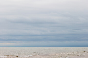 Fototapeta premium Threatening storm clouds form over Lake Michigan in late Ausgust off the coast of Harrington Beach State Park, Belgium, Wisconsin
