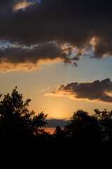 Beautiful sunset over the forest trees, aerial view