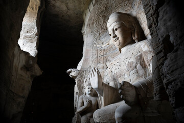 giant stone buddha in Yungang Grottoes in Datong, China