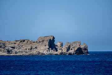 panoramic view of a bay with turquoise water on a sunny day on the island of Crete in Greece