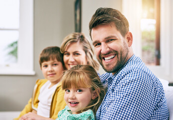 Obraz premium Family, portrait and happy in house for relax, bonding and support with parents, love and care. Mom, dad and children in living room for comfort, relationship and embrace together on weekend on sofa