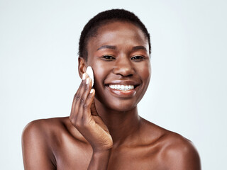 Skincare, cotton pad and portrait of black woman in studio with hydration, collagen and facial routine. Beauty, health and African person with dermatology treatment for glow by white background.