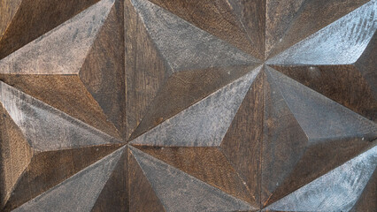 Texture of brown wooden triangles on the side of a piece of design furniture.