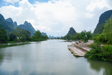 bamboo rafts sailing over river Yulong in Yangshuo, China