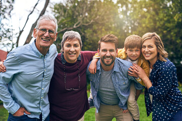 Big family, love and outdoor portrait with kid, vacation and support in relationship connection. Grandparents, parents and generations for security embrace in countryside, care and travel to England
