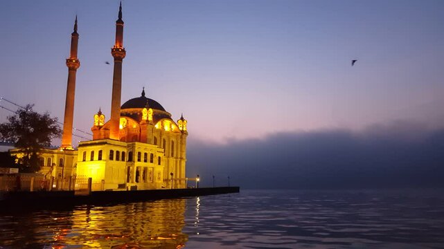 Magnificent fog view in the morning hours at Ortak&ouml;y Mosque and Bosphorus Bridge (July 15 Martyrs Bridge)